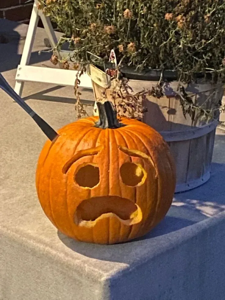 kid friendly pumpkin carving ideas with mustache pumpkin, round eyes, open mouth, and funny face