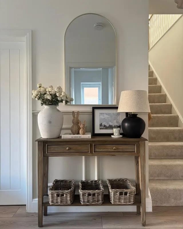 entryway table decor with classic console baskets lamp flowers and stairs