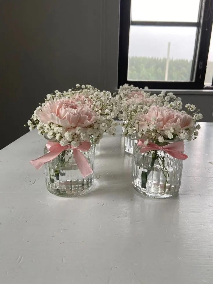 girl baby shower brunch flowers in simple glass vases