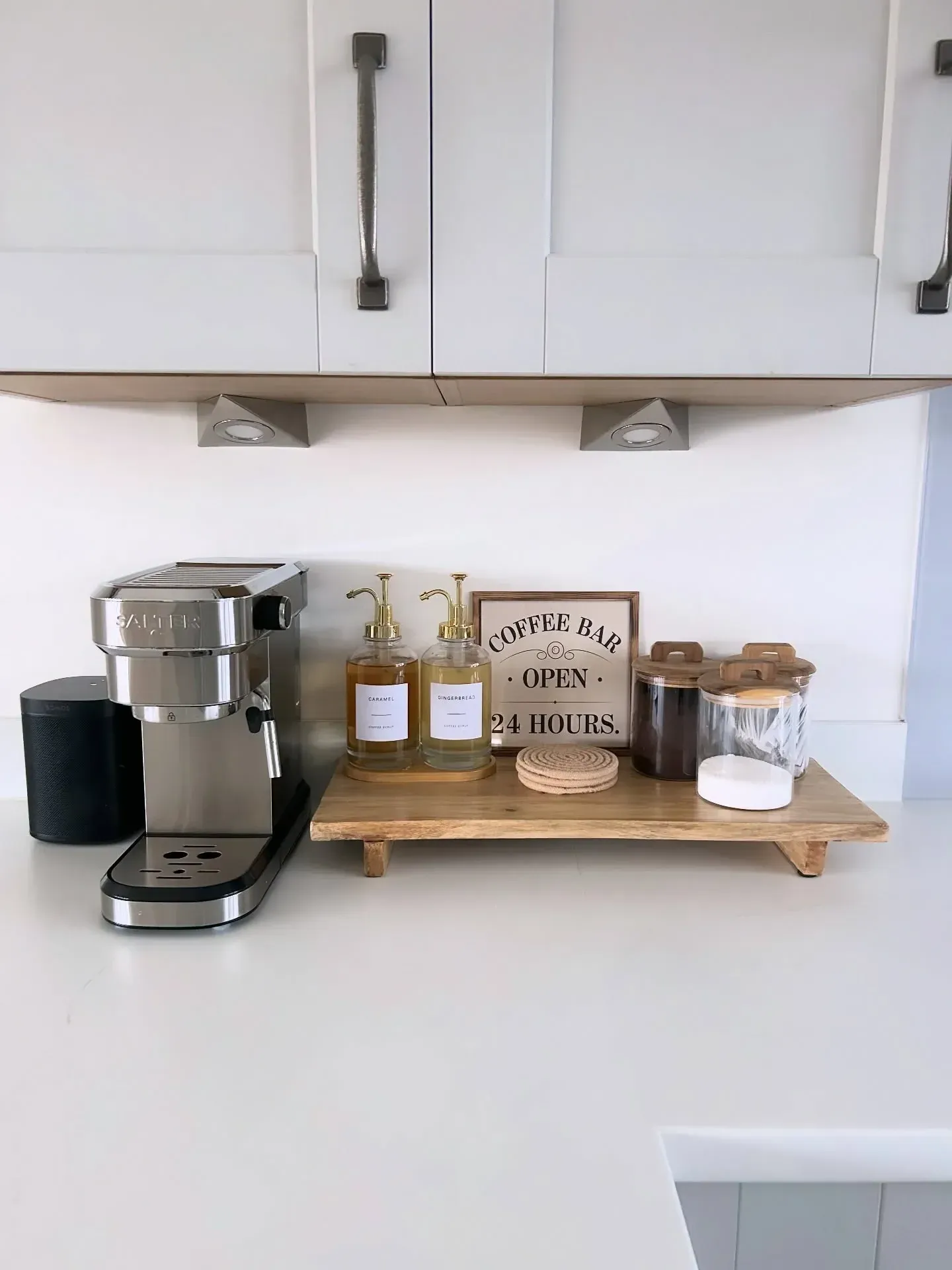 minimal coffee station ideas with espresso machine, wood shelf, mugs, and simple counter