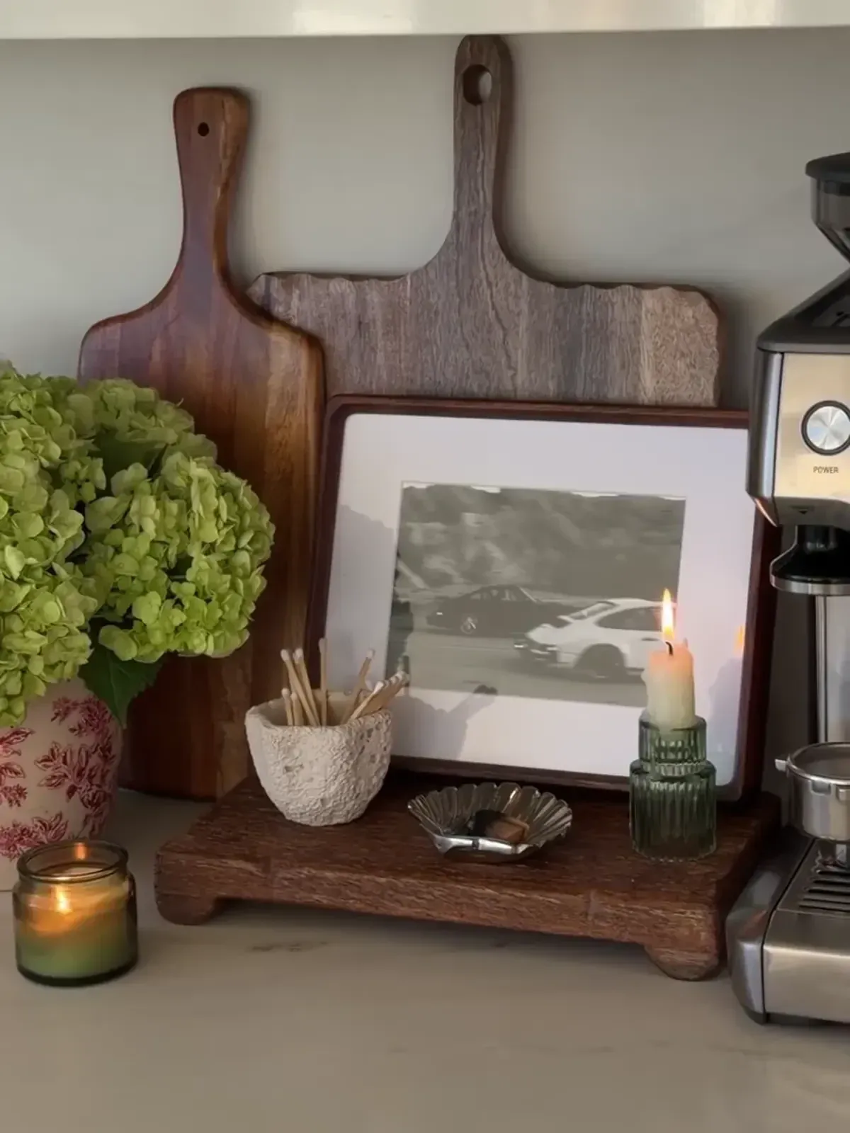 simple coffee station ideas with wooden tray, mugs, cutting boards, and small decor