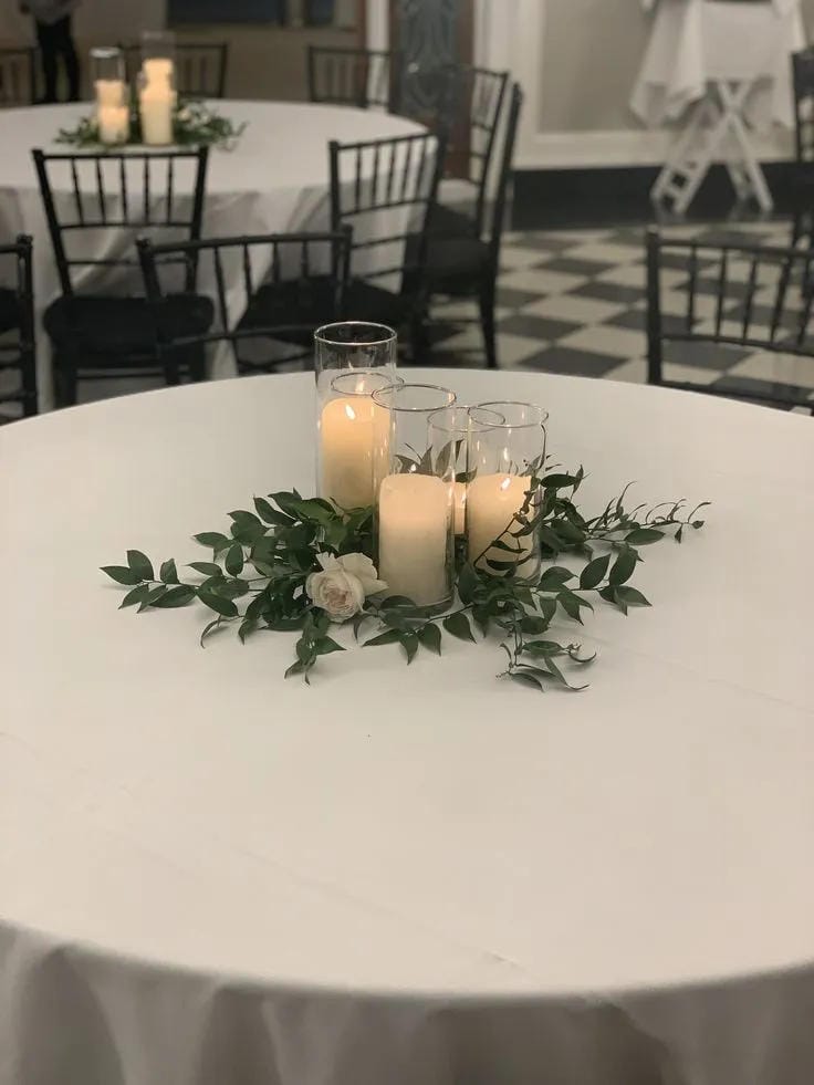 rustic reception table centerpiece with romantic candlelight