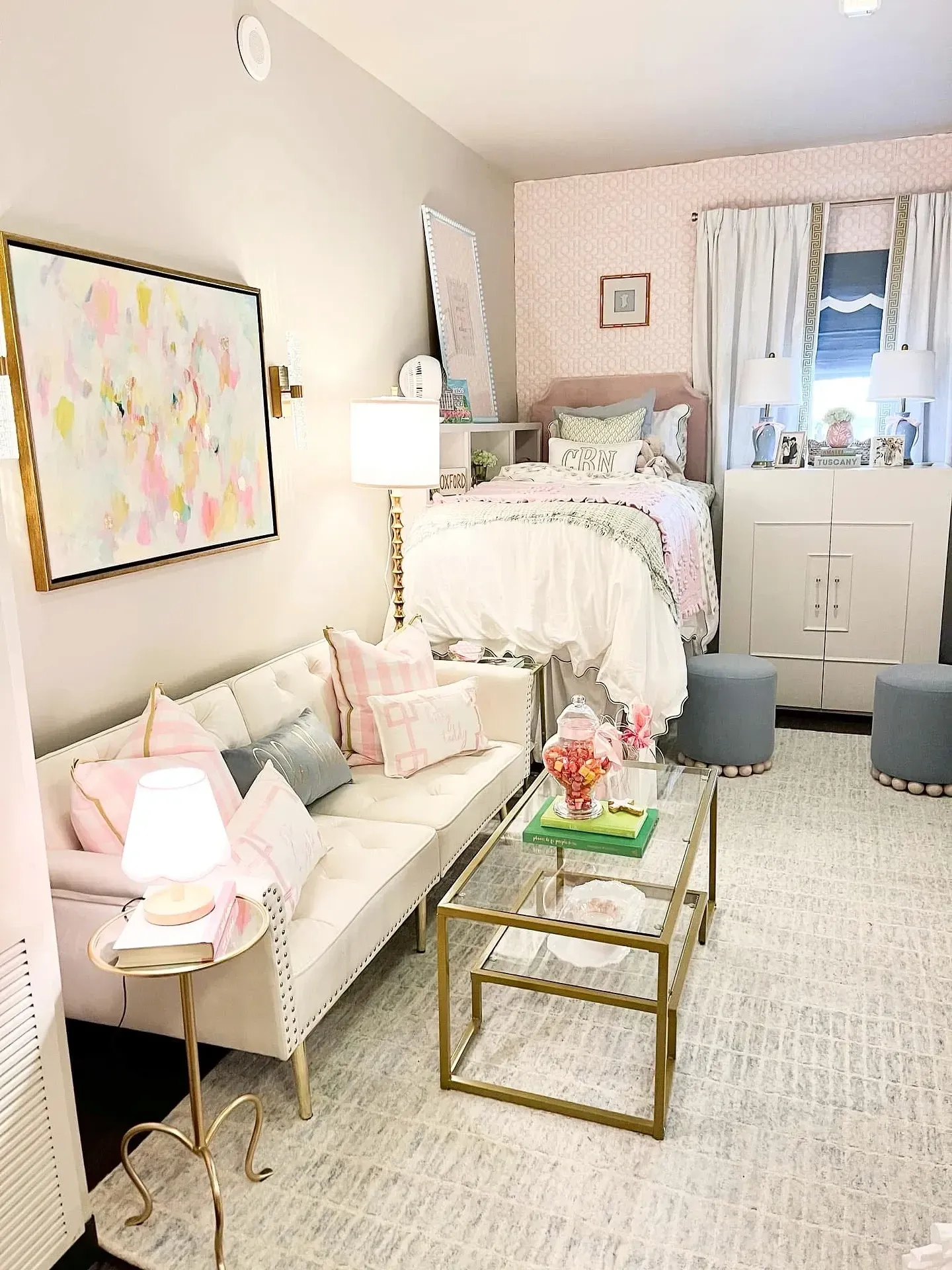 pink and green dorm room ideas with a pink sofa green accents and dorm wall art