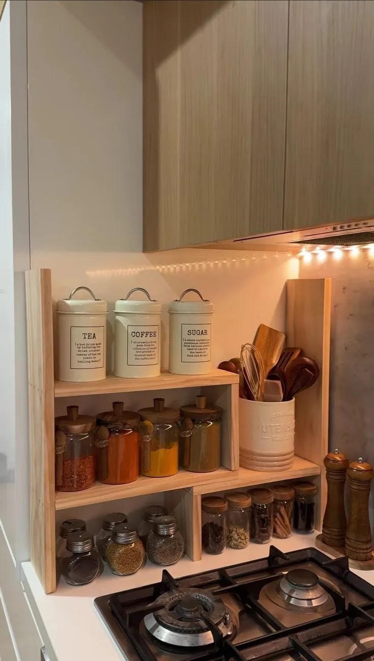 kitchen organization ideas with small wall shelves spice jars oils and canisters