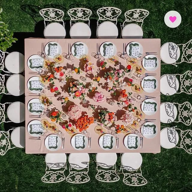 square garden bridal shower table with colorful flowers and place settings