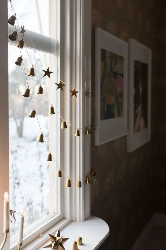 Hanging window ornaments and candlelight for Scandinavian Christmas decor