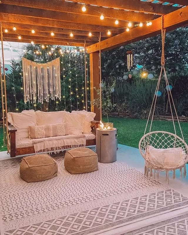 covered porch ideas with string lights outdoor sofa poufs and hanging chair