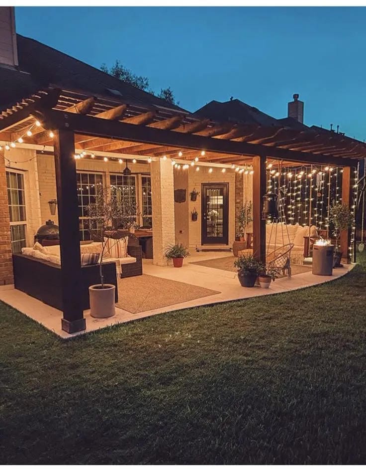 covered porch ideas with pergola string lights outdoor dining and evening seating