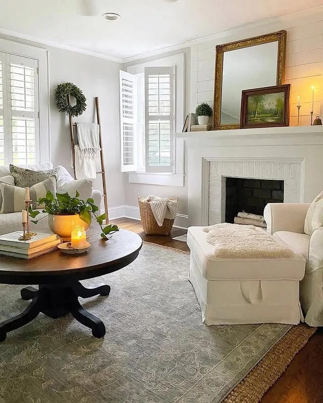 coffee table decor ideas with round black table books candle potted plant and cozy living room