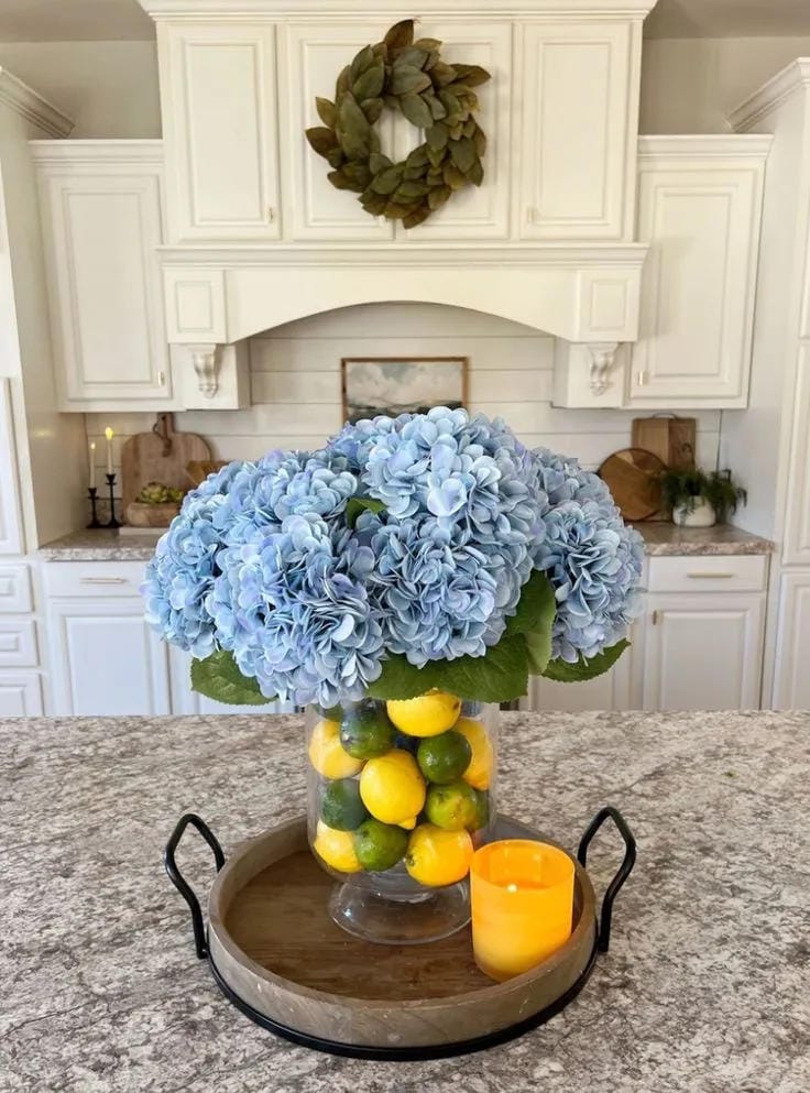 summer living room coffee table decor with greenery