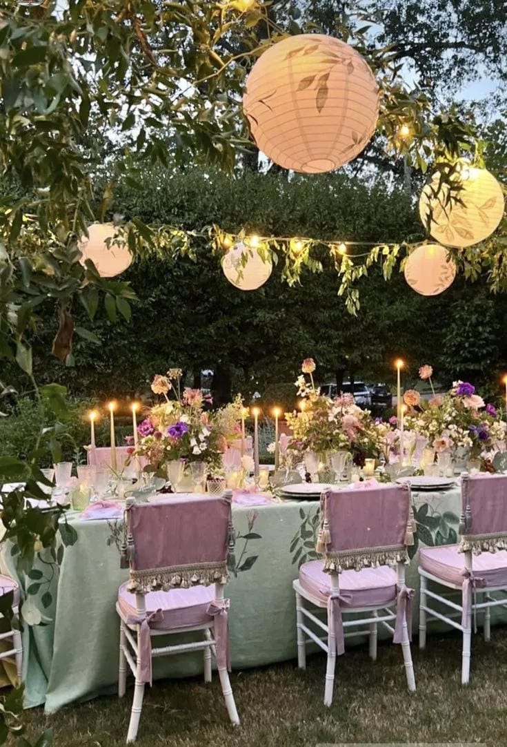 garden bridal shower table decor with candles and blooms