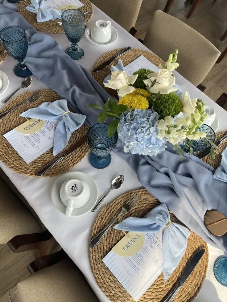 boy baby shower table decor with blue napkins and glassware