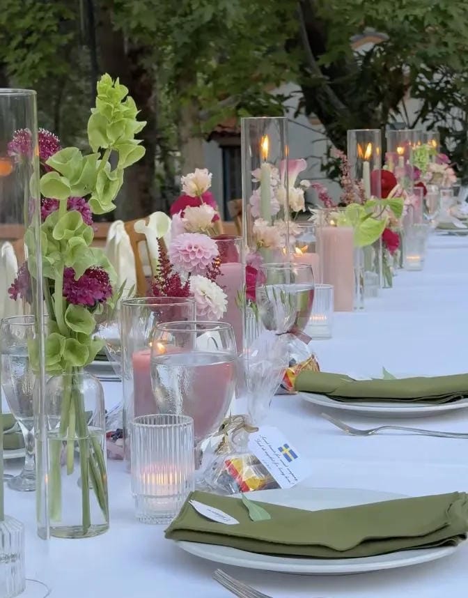 outdoor bridal shower backdrop with flowers and signage
