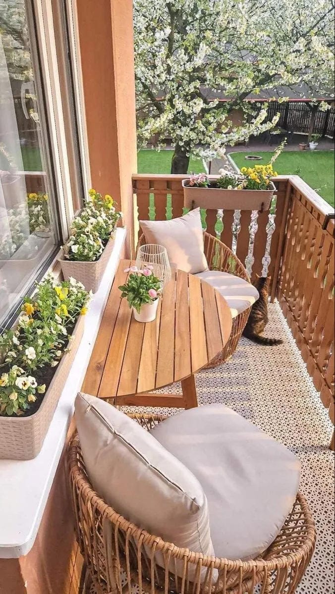 tiny front porch with potted plants and cozy details