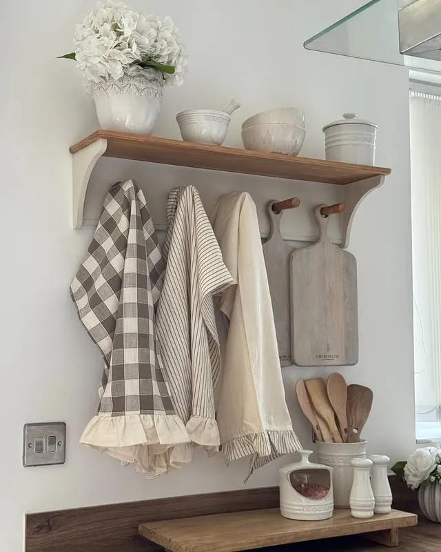 kitchen organization ideas with wall hooks aprons shelf and utensil storage