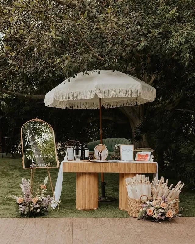 wedding welcome table decor ideas with flowers and signage