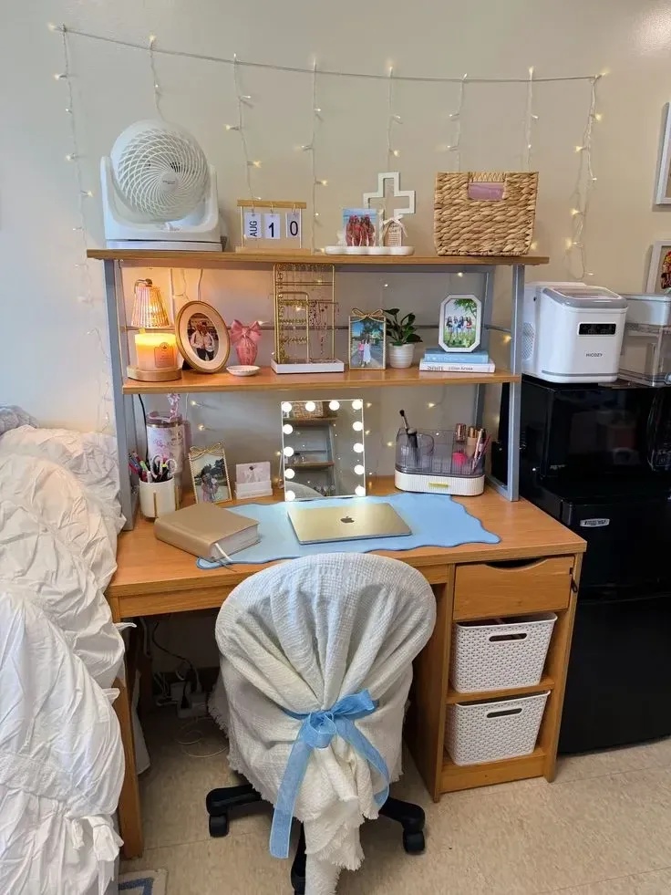 dorm desk ideas with a vanity mirror lights shelves laptop and white chair
