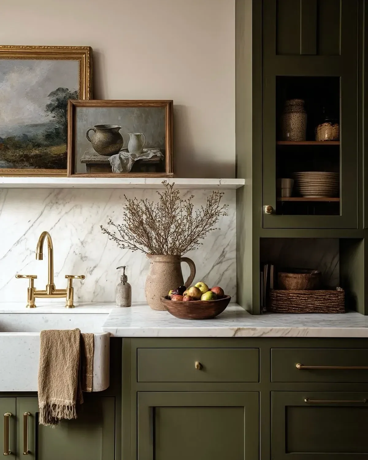 vintage home decor ideas with olive kitchen cabinetry, shelves, art, and brass details