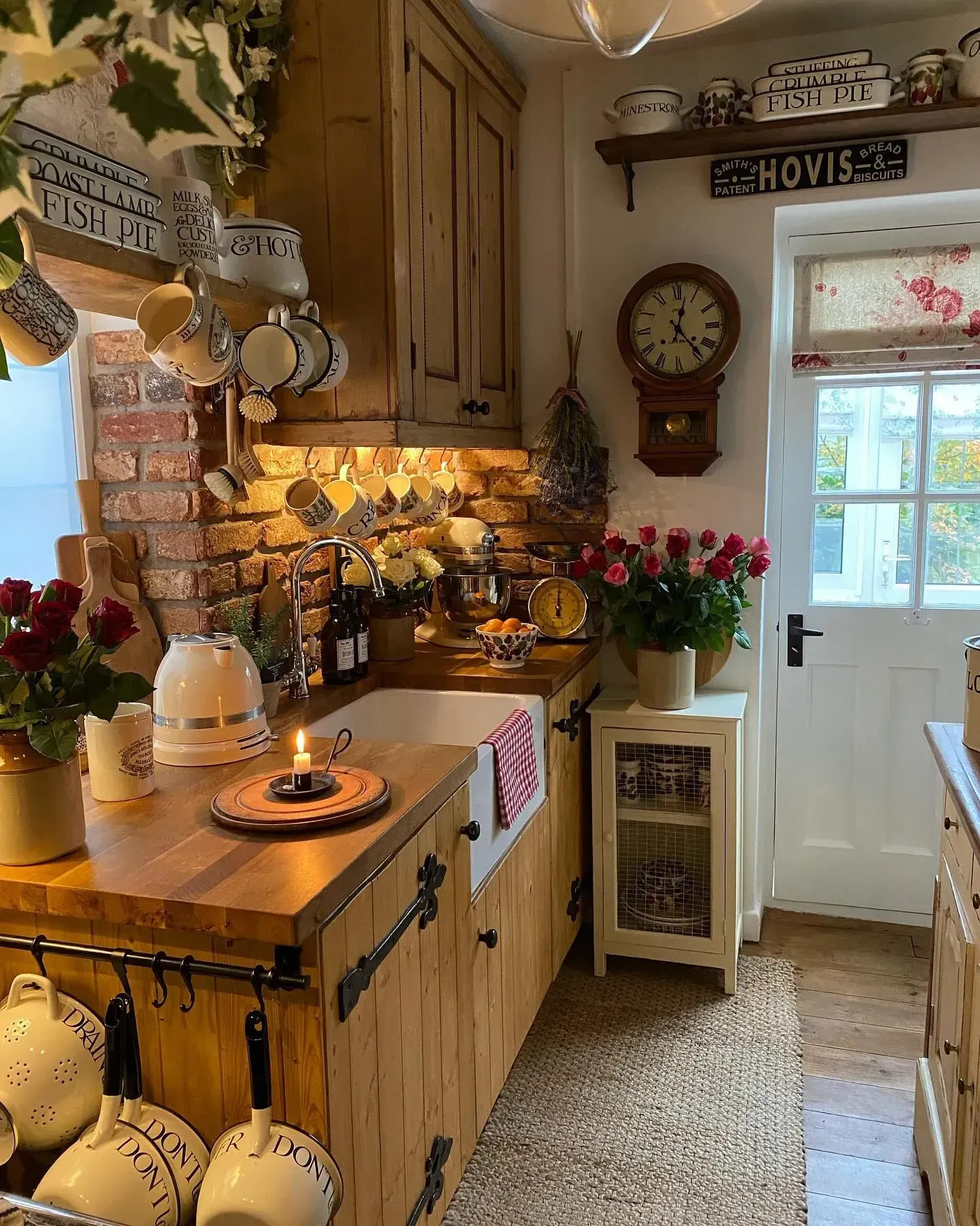 modern vintage home decor ideas with yellow cabinet, warm lighting, plants, and kitchen shelf styling