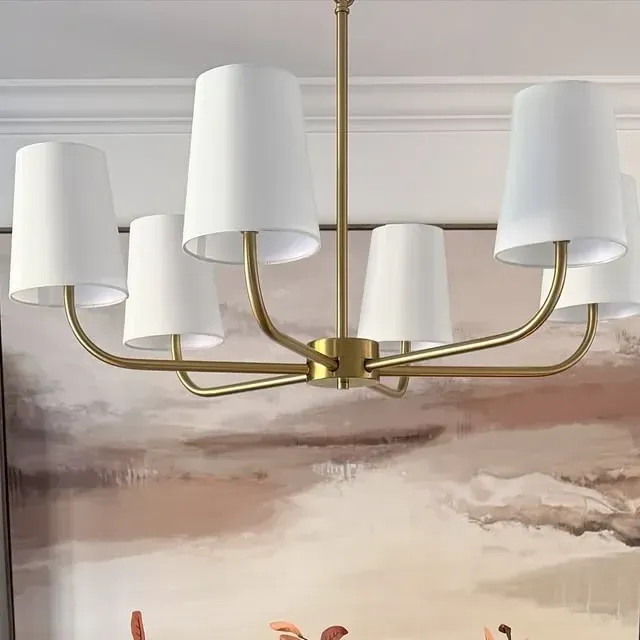 fall dining room with warm artwork, brass chandelier, neutral colors, and simple fall table decor inspiration