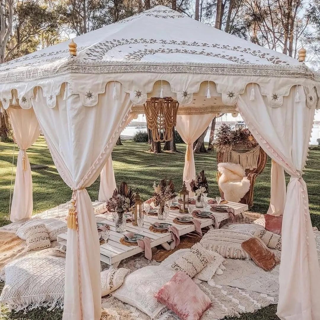 backyard party aesthetic ideas with host under a white gazebo