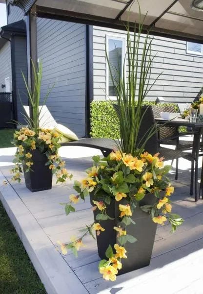 tall outdoor planter ideas with add yellow flowers to a black pot